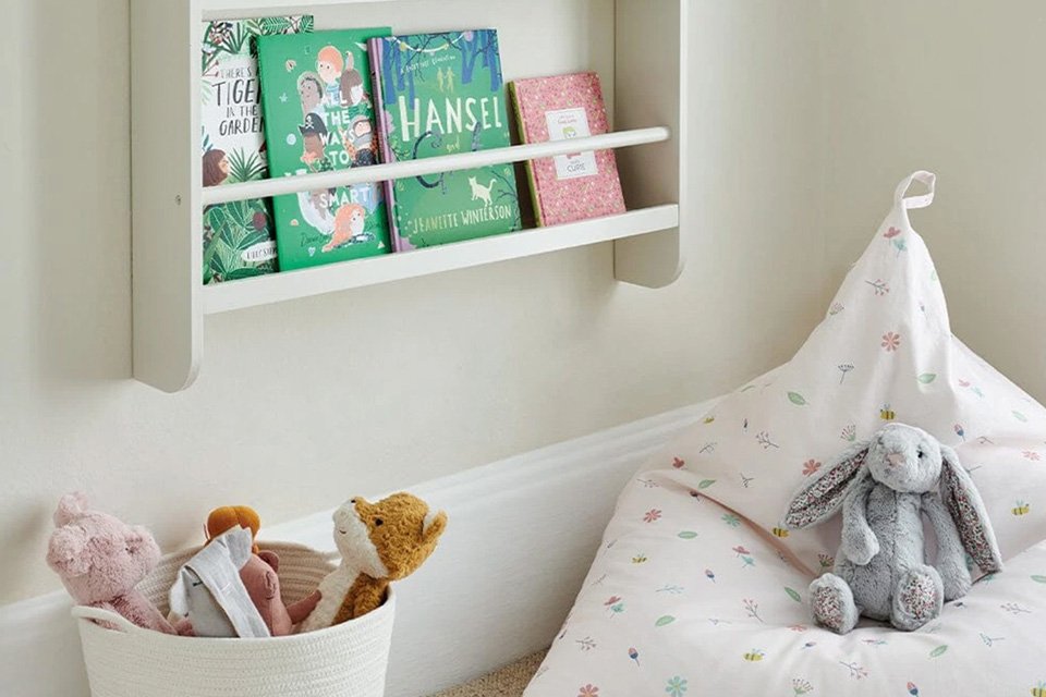 A white Great Little Trading Company Buzzy Bloom bean bag.