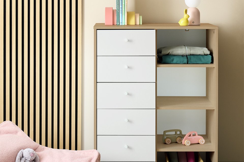 A Malibu kids' 6 drawer open shelf chest in white. 