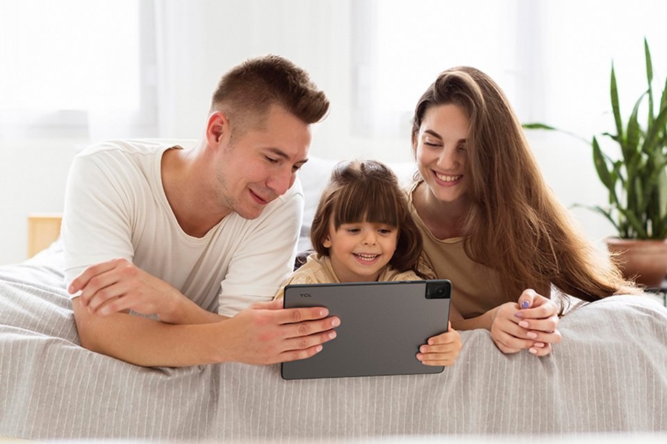 A family watching something on a TCL 10 L Gen 2 tablet.