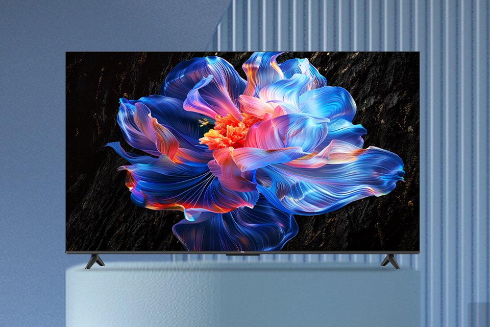A colourful and abstract screensaver displayed on a TCL 4K UHD TV against a blue background.