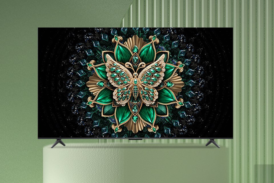 A bright and colourful screensaver displayed on a TCL Mini LED TV against a green background.