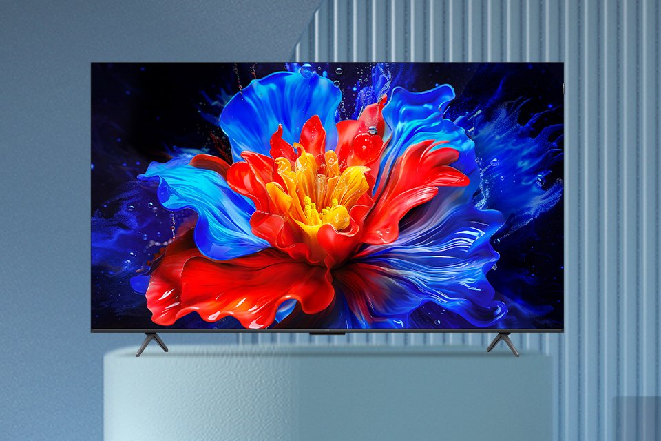 A bright and colourful screensaver displayed on a TCL QLED TV against a blue background.