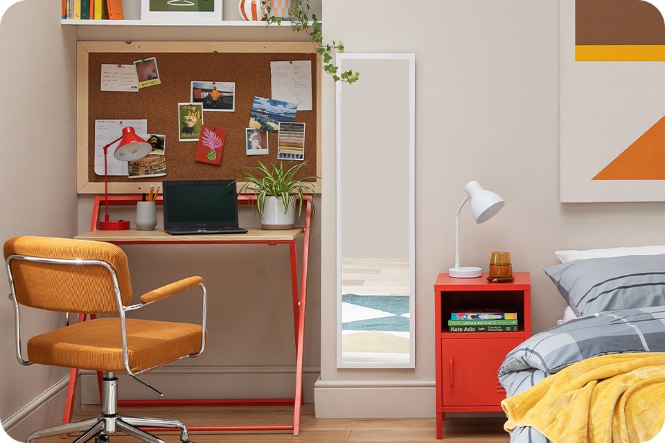 uni bedroom featuring a red desk and orange change and a double bed