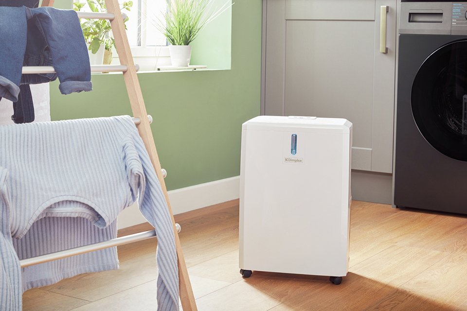 Dimplex 14 Litre Dehumidifier placed in a laundry room.