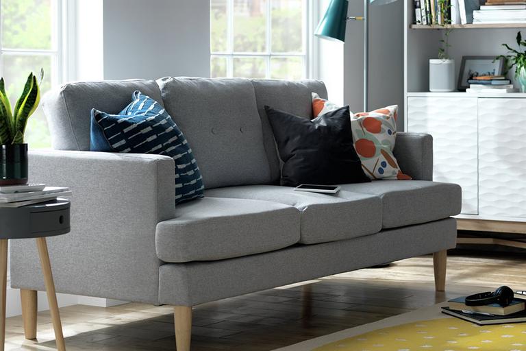 The grey Habitat Joshua 3-seater fabric sofa in a light, bright lounge setting.
