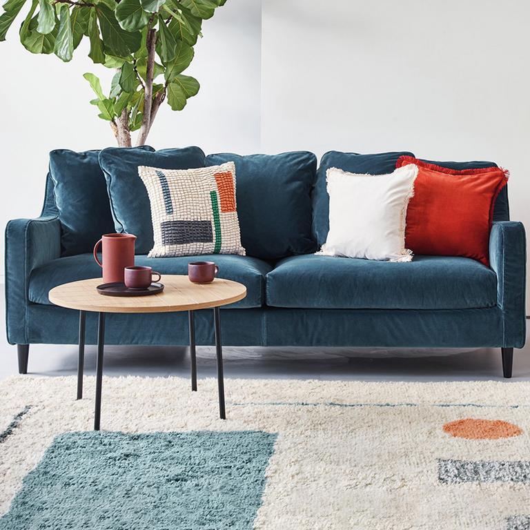 The blue Habitat Swift 3-seater velvet sofa in a modern lounge setting.