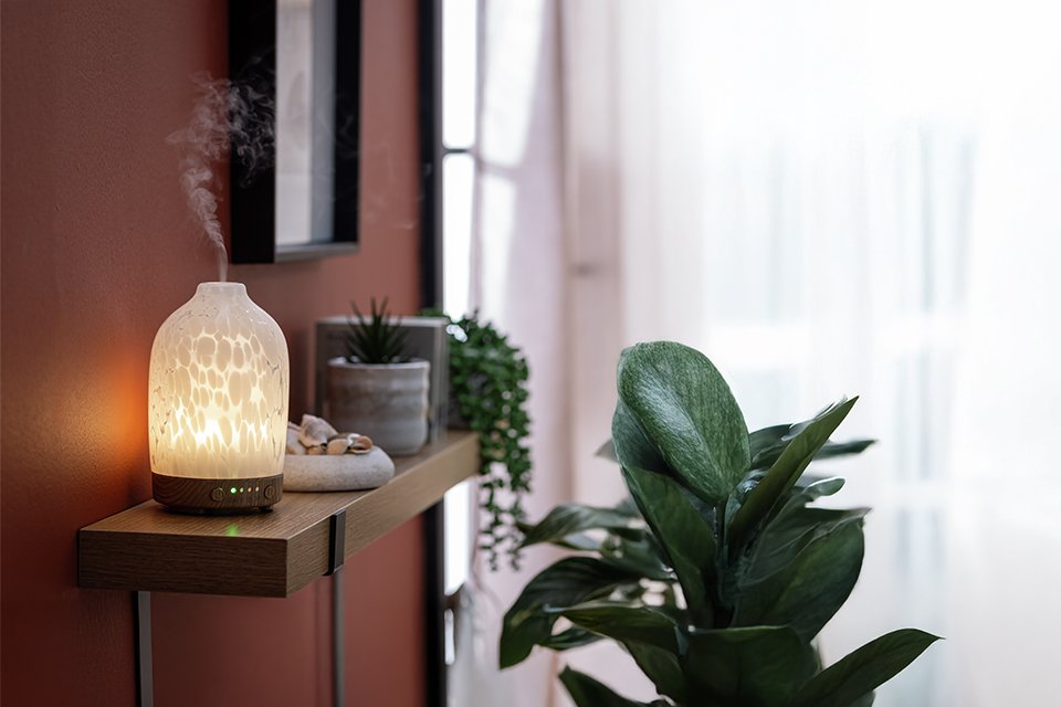 A white Habitat Confetti glass electric diffuser in a living room.