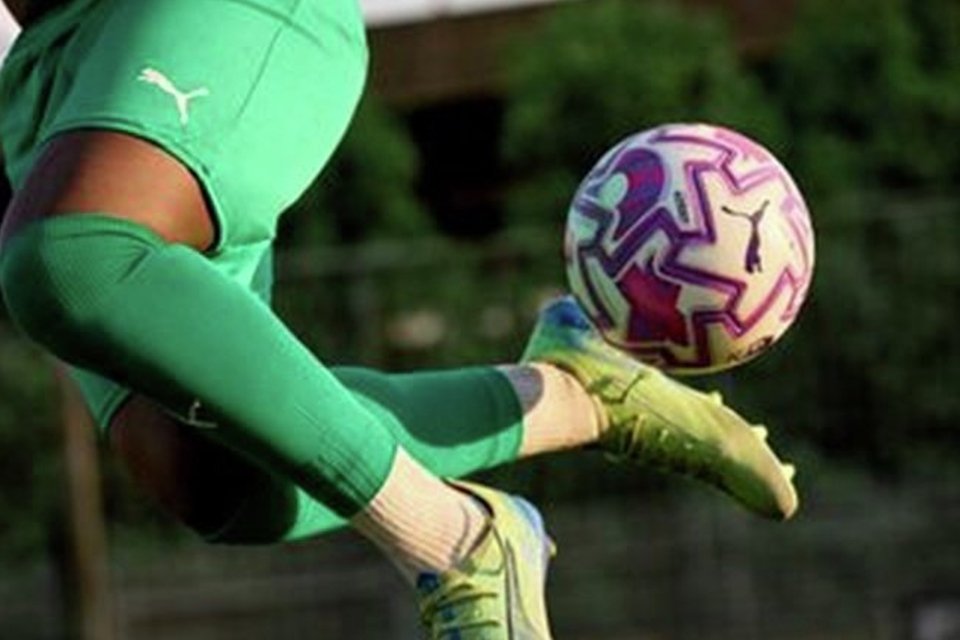 close up of player controlling a football