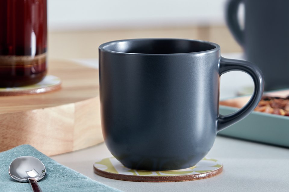 A Habitat matte glaze set of 4 stoneware mugs in charcoal colour.