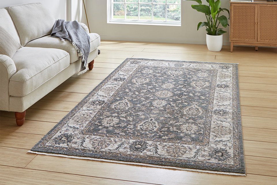 A Think Rugs vintage green short pile rug in a living room.