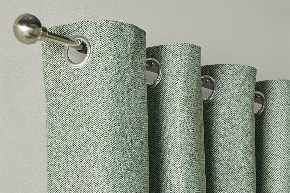 Habitat Textured Blackout Herringbone Eyelet Curtain in green colour.
