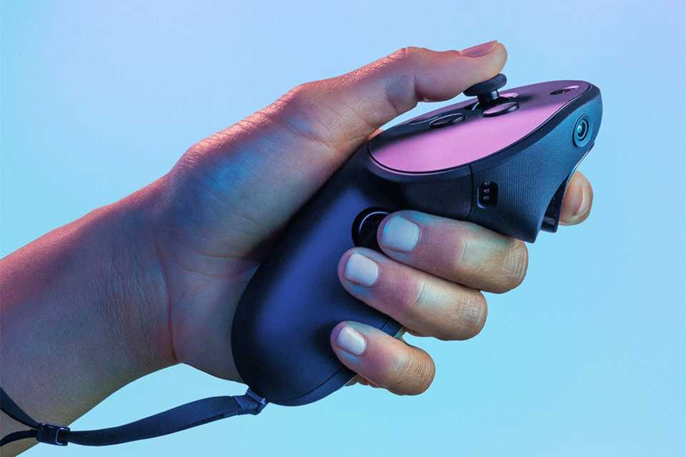A person holding a VR headset controller.