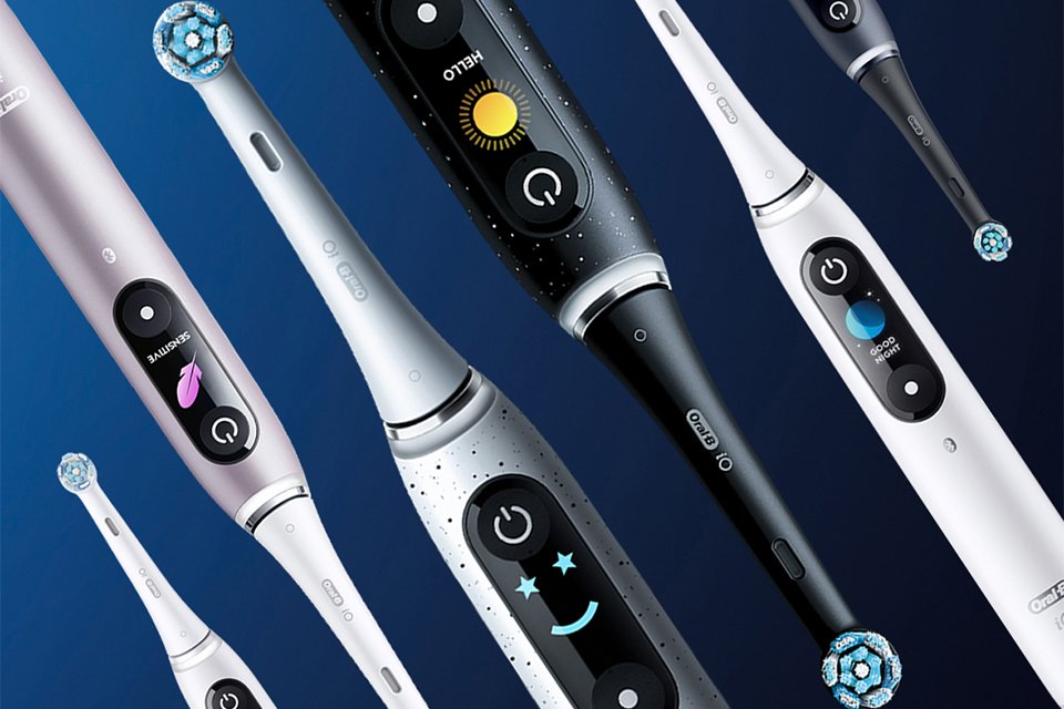 Various coloured Oral-B electric toothbrushes displayed next to each other.