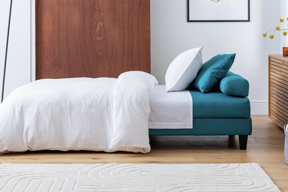 Chaise clic clac sofabed in teal.