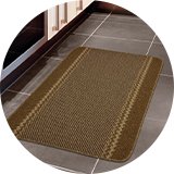 Kilkis Machine Washable Cut Pile Rug in Brown.