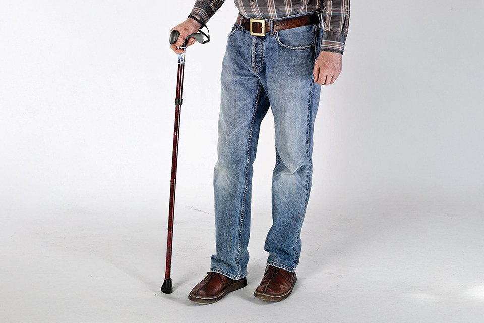 A man using a Drive Devilbliss healthcare adjustable folding walking stick.