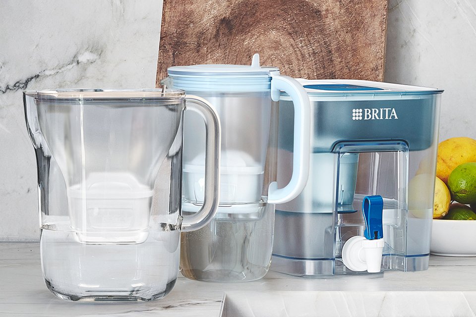 A BRITA Style Essential, Glass Jug & Flow Tank on a kitchen worktop.