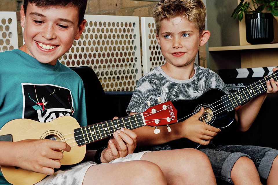 2 kids playing 3rd Avenue Soprano Ukulele.