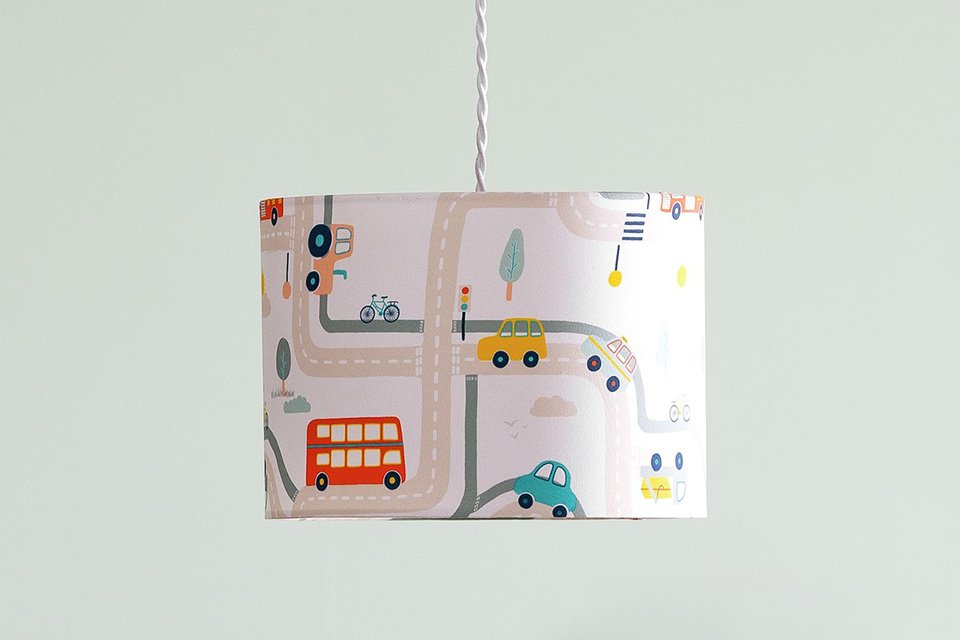 A Habitat jungle print lampshade in a kids' room.