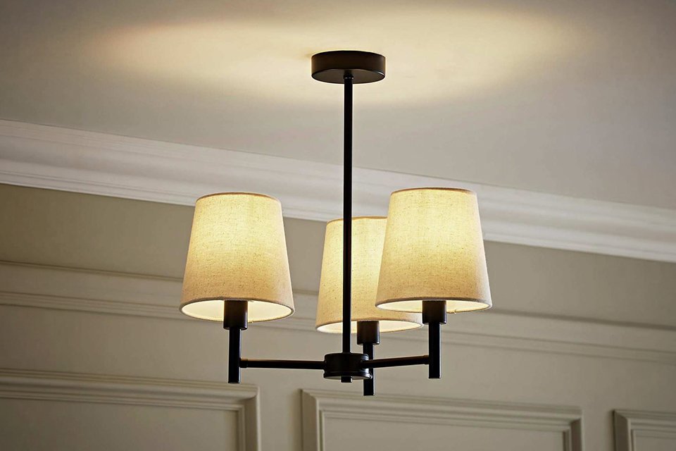 A ValueLights Kincaid black metal 3-light chandelier.