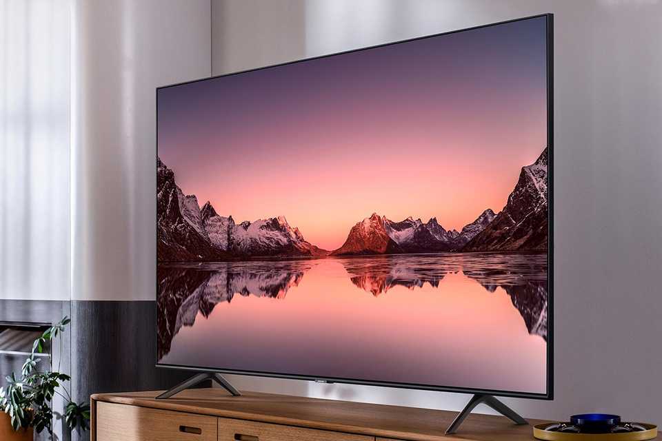 A 55 inch television with a QLED display.