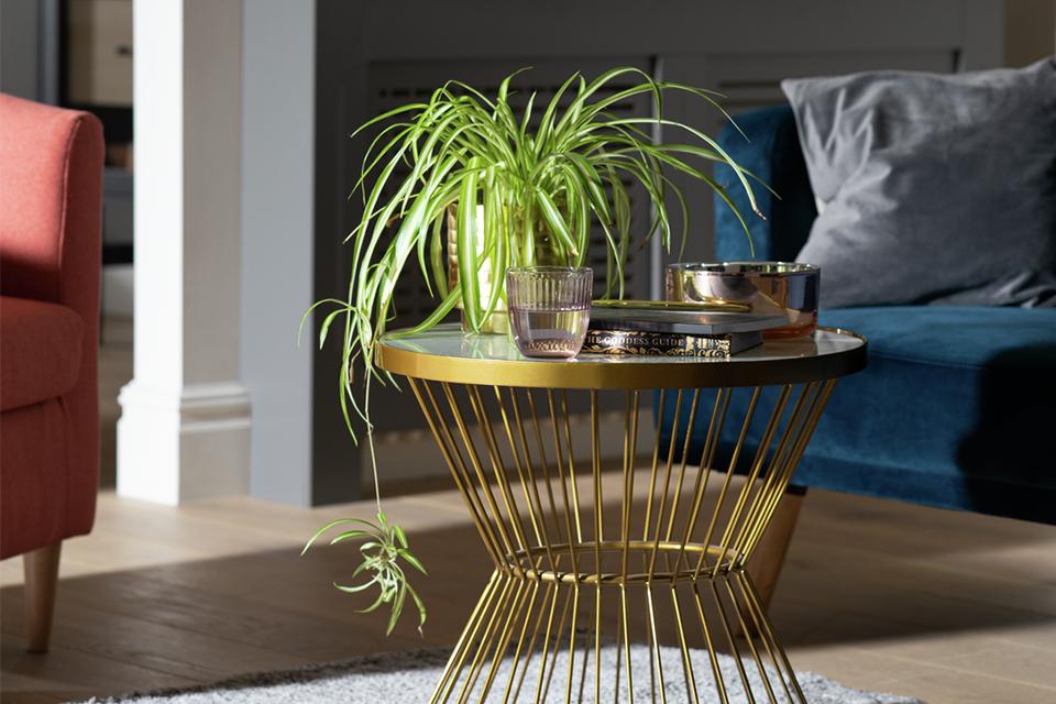 White glass coffee table with brass base.