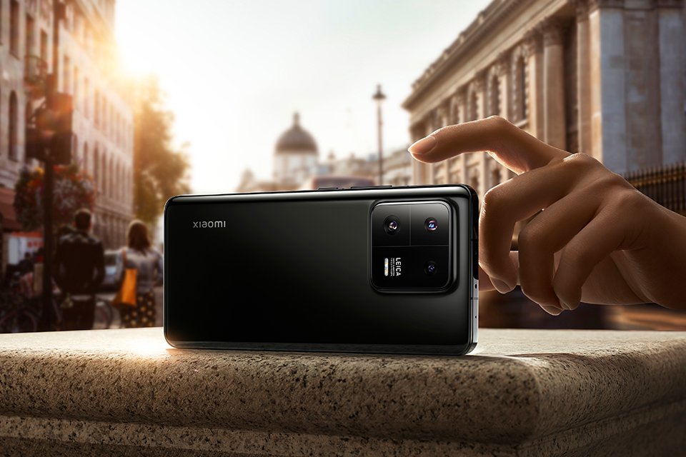 The backside of a Xiaomi 13 5G smartphone with its rear camera setup.