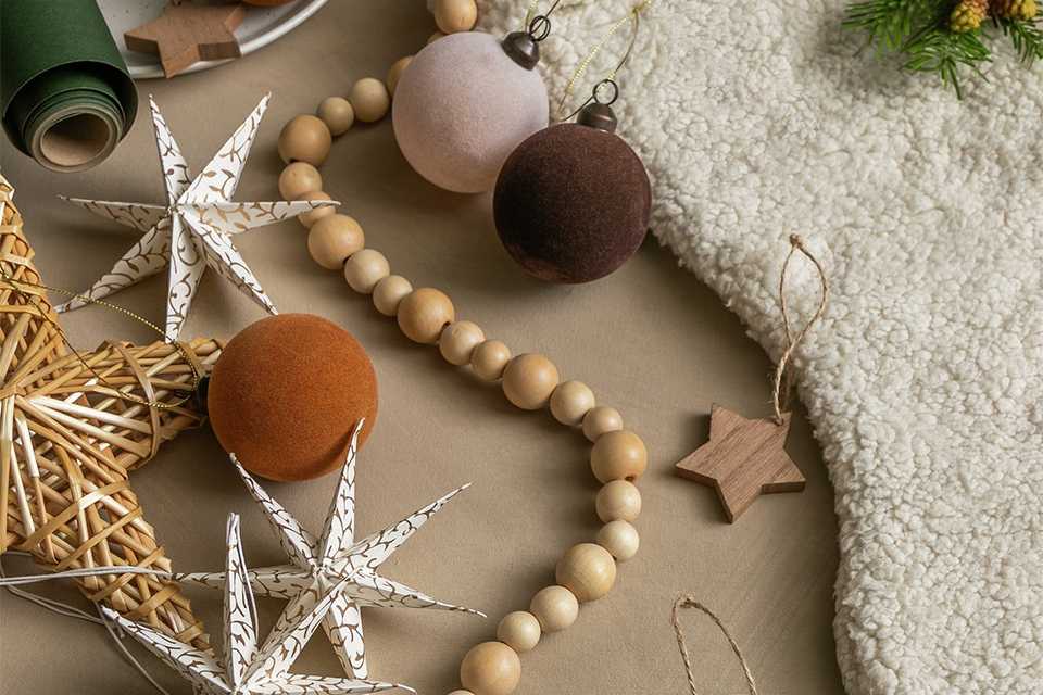 Wooden star Christmas tree decoration, wooden tree topper,  baubles and other Christmas decorations.