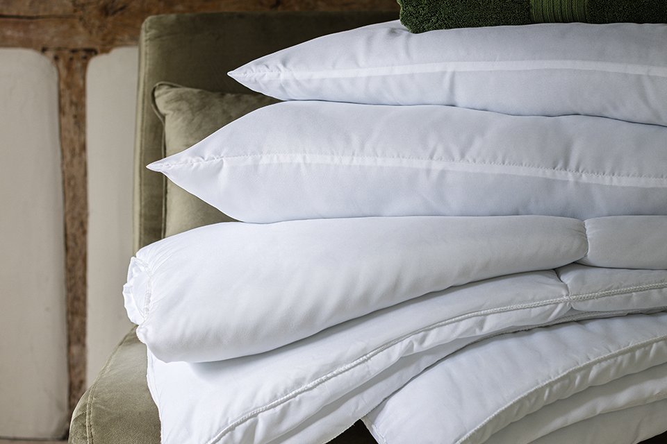 Girl sitting on floor singing karaoke.