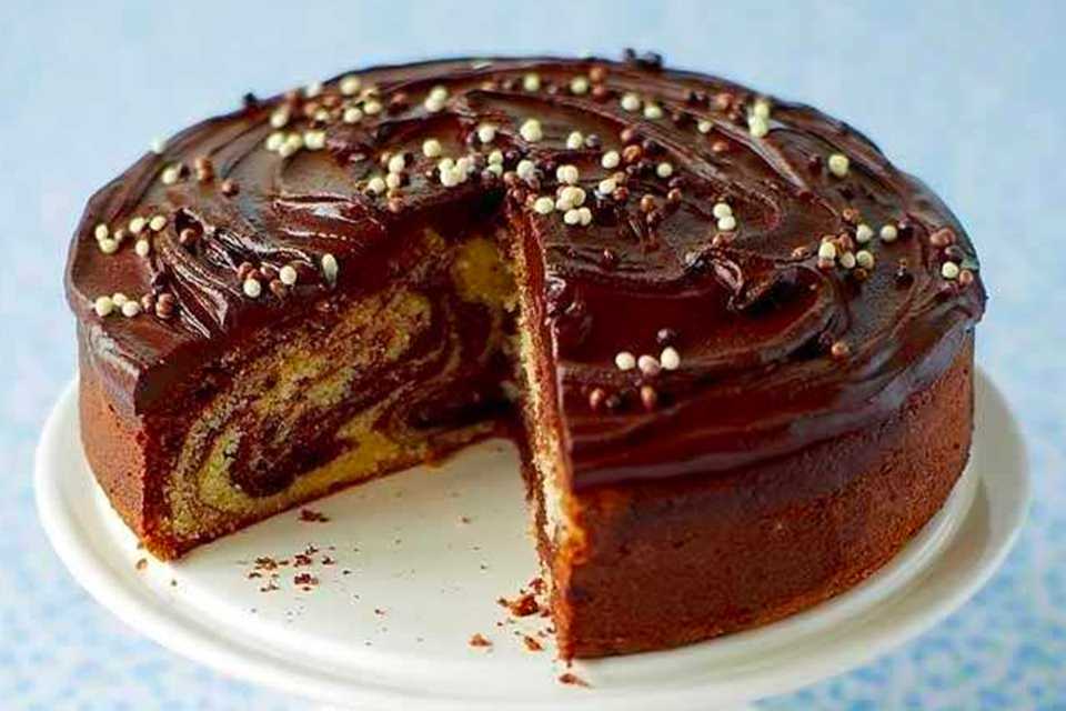 A marble cake on a white plate.