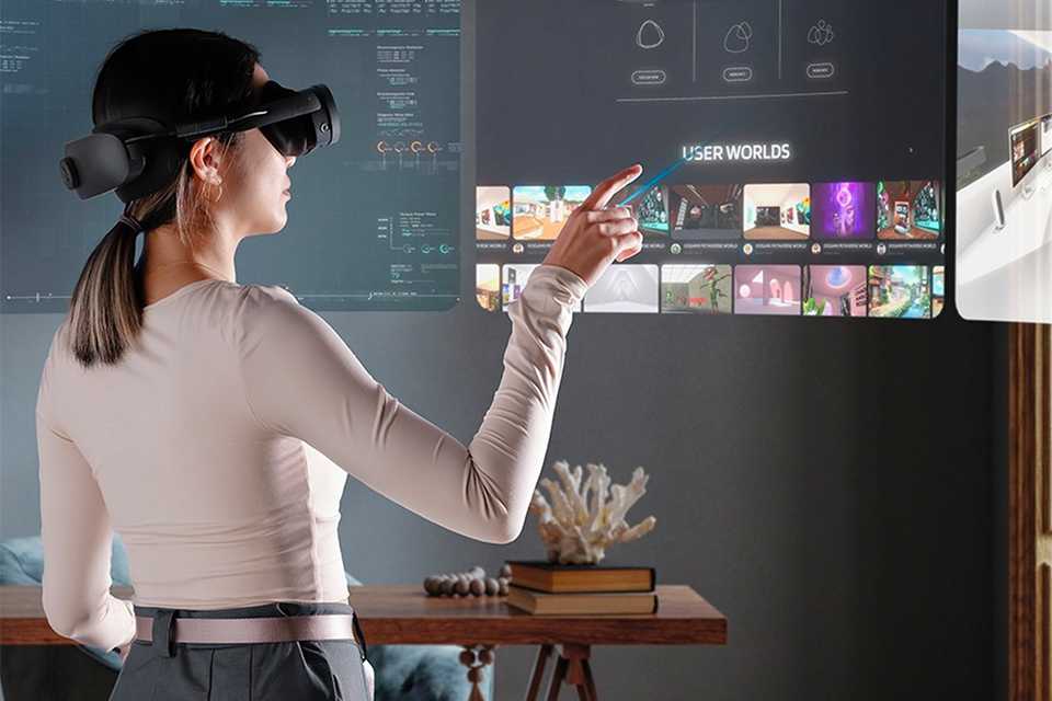 A woman browsing games on the HTC VIVE XR Elite All-in-One VR Headset.