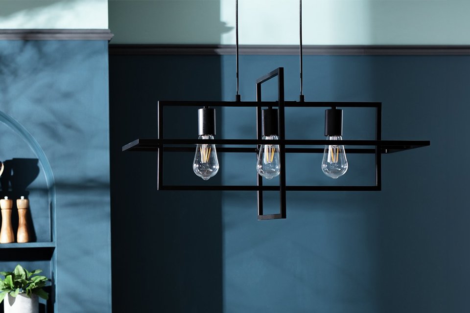 Black abstract ceiling light in kitchen.