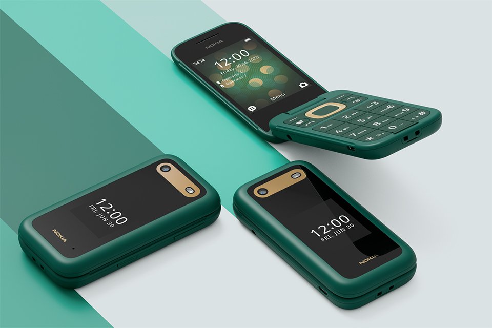 Three green Nokia 2660 Flip mobiles phones displayed. 