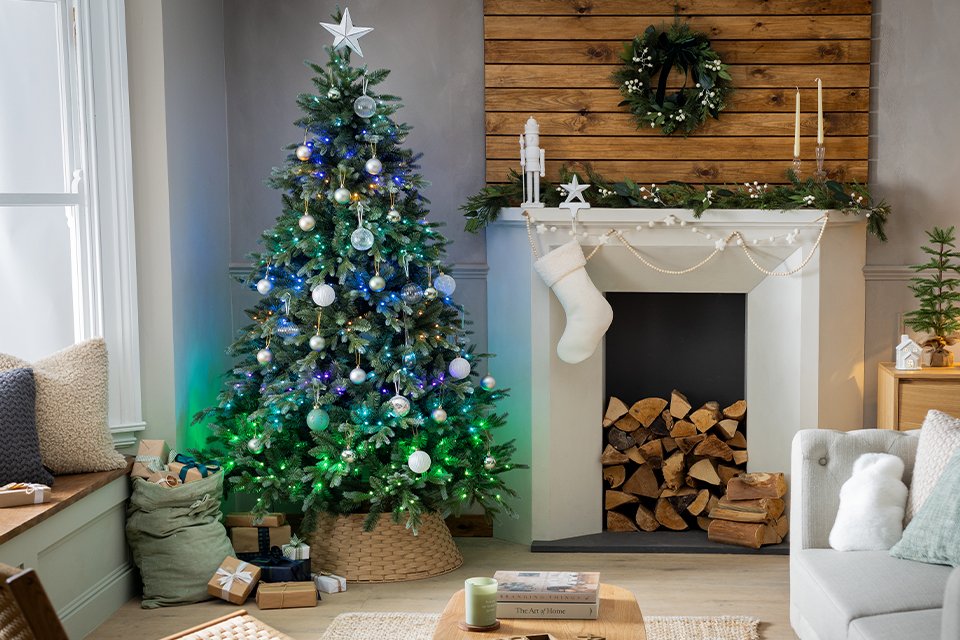 A Christmas tree sitting in a living room.