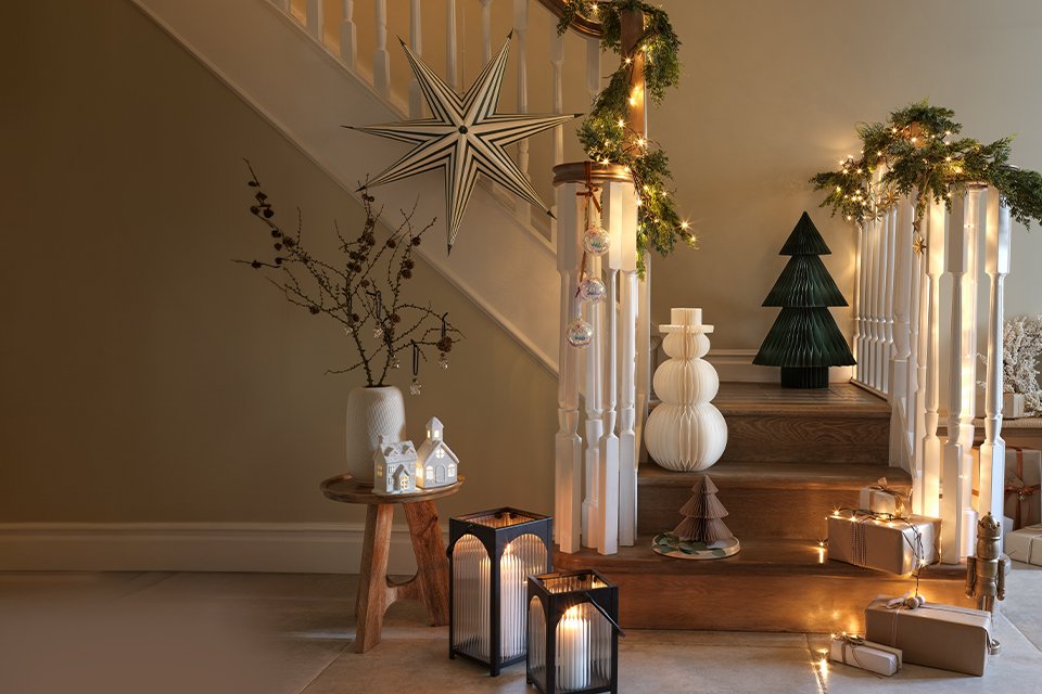A staircase decked up with beautiful Christmas decorations.