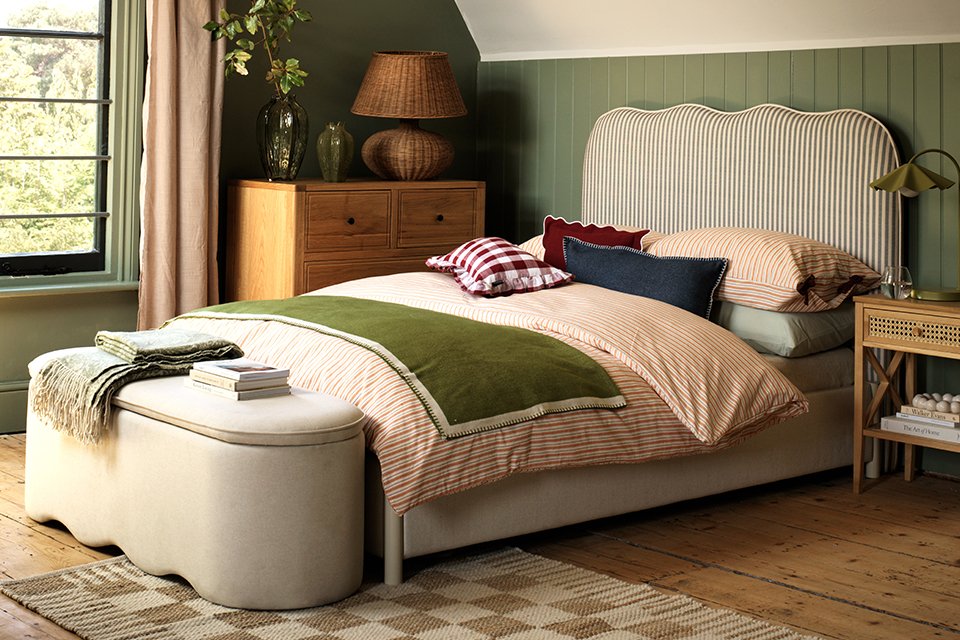 Wooden ribbed lamp on wooden desk.