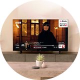 Bush 50 Inch 50UT24SB Smart 4K UHD HDR LED TiVo Freely TV in a living room setup.