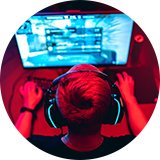 A person playing video games on his gaming computer. 