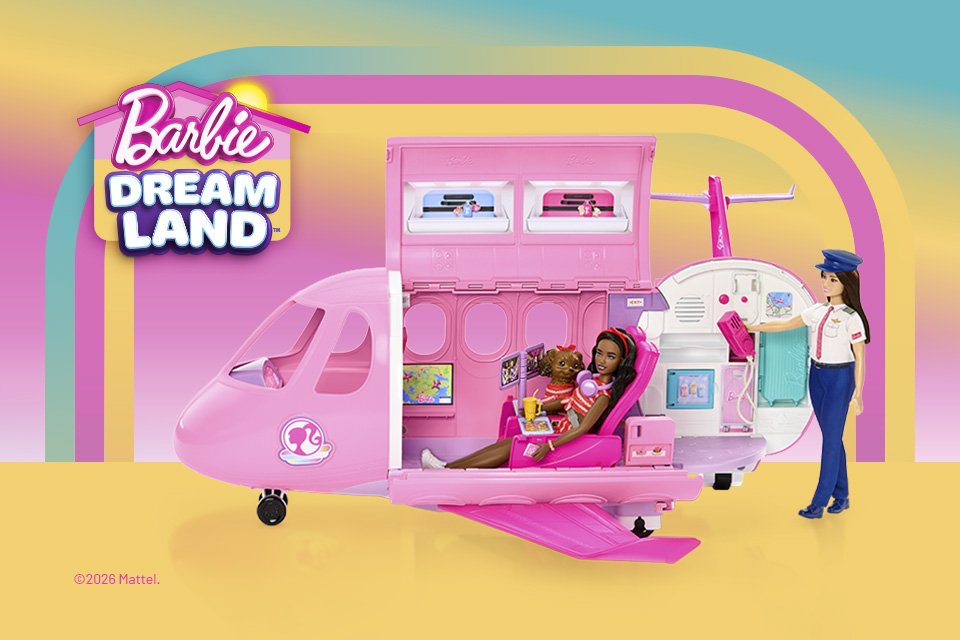 A Barbie doll seated inside a pink Barbie airplane with a toy dog while a pilot Barbie looks on.
