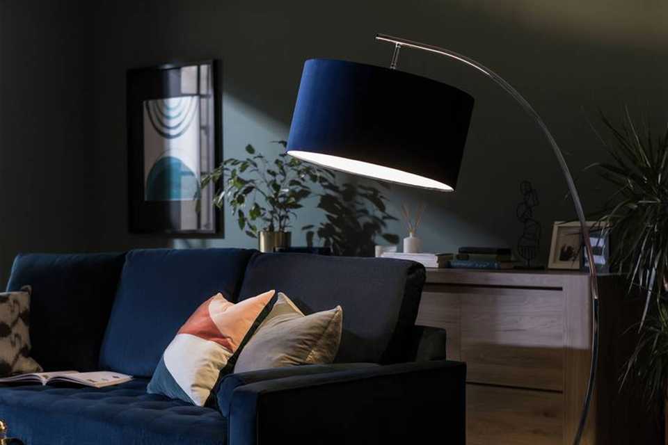 Navy blue living room with navy lamp and accessories.
