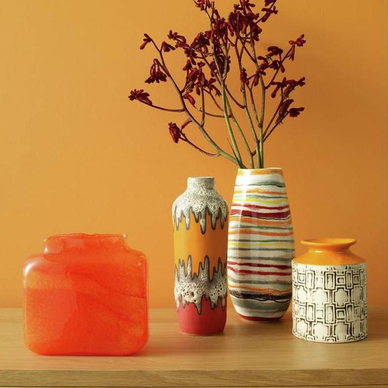 Image of an orange jar and a plant pot.