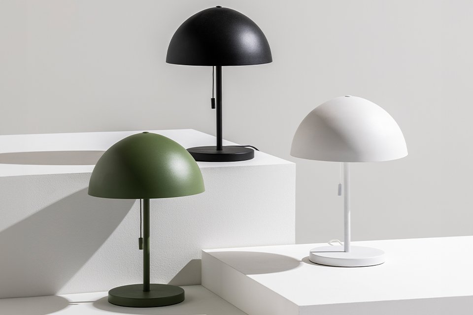 Grey office table lamp on table with laptop.