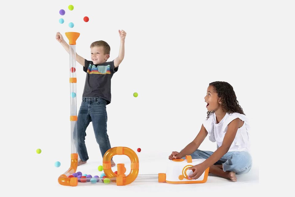 Two kids playing with Fat Brain Toys Air Toobz.