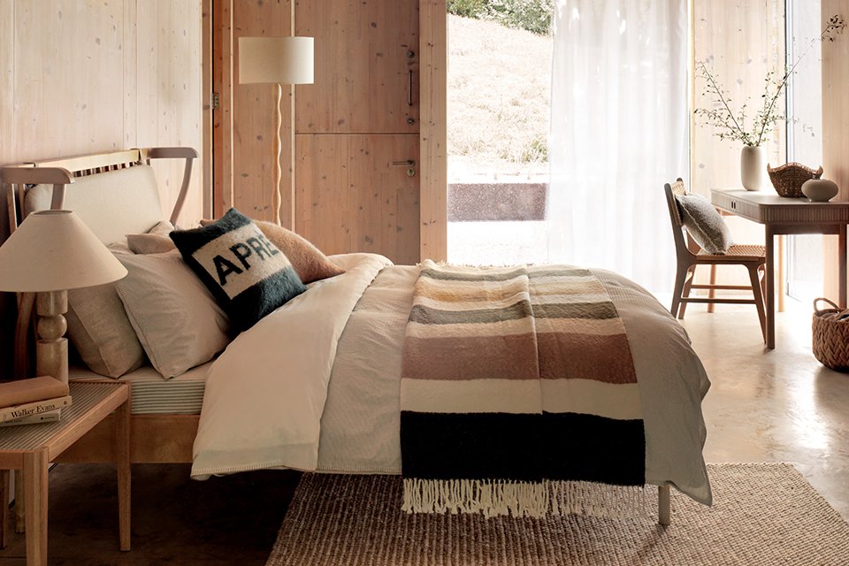 A bedroom designed using Habitat furniture in the Alpine retreat trend style.