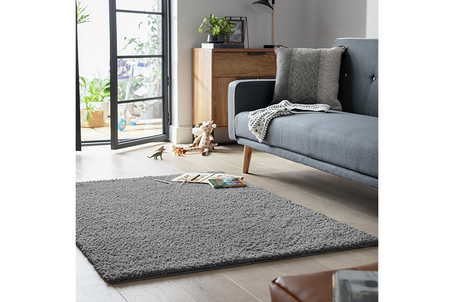 Habitat Flint Grey cut pile rug in a living room setup.