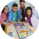 A family playing Monopoly Knockout board game together.