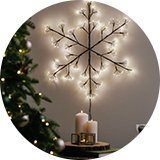 A Habitat warm white black frame snowflake Christmas light.