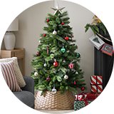 Habitat 5ft Mixed Cashmere Christmas Tree placed next to a mantel.