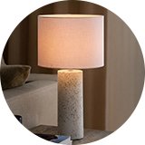 A Nordlux Antiga Terrazzo table lamp on a table.