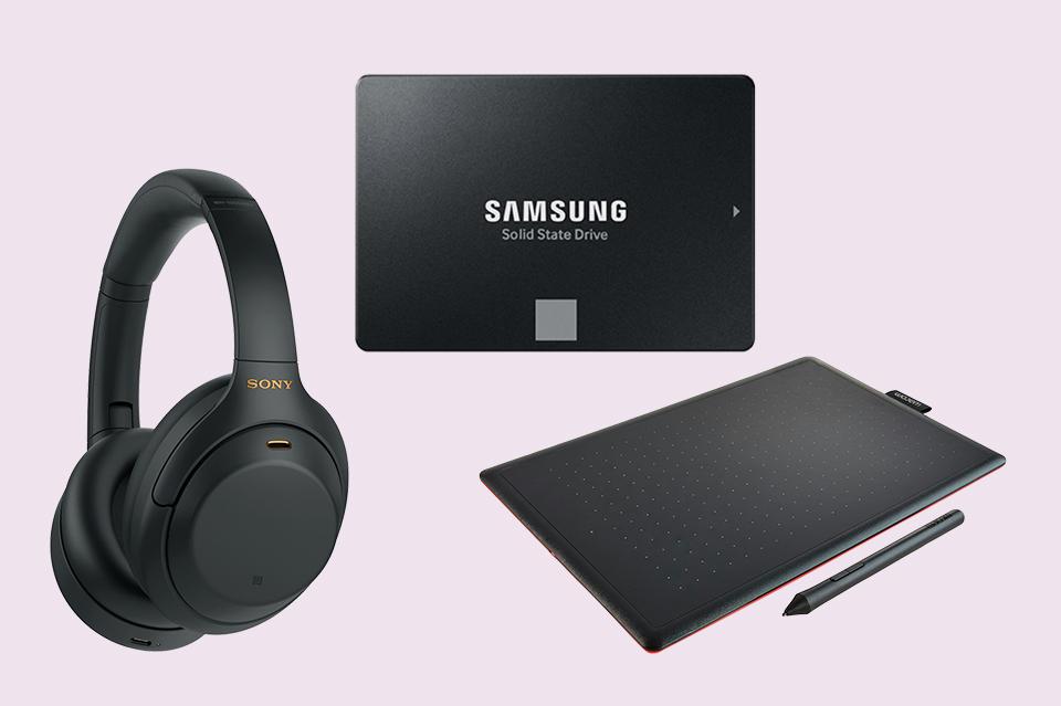 Graphic design tablet, solid state external hard drive and pair of headphones.